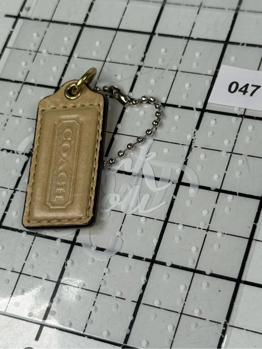 Coach two tone embossed gold front & metallic Leather back hang tag Key w Chain